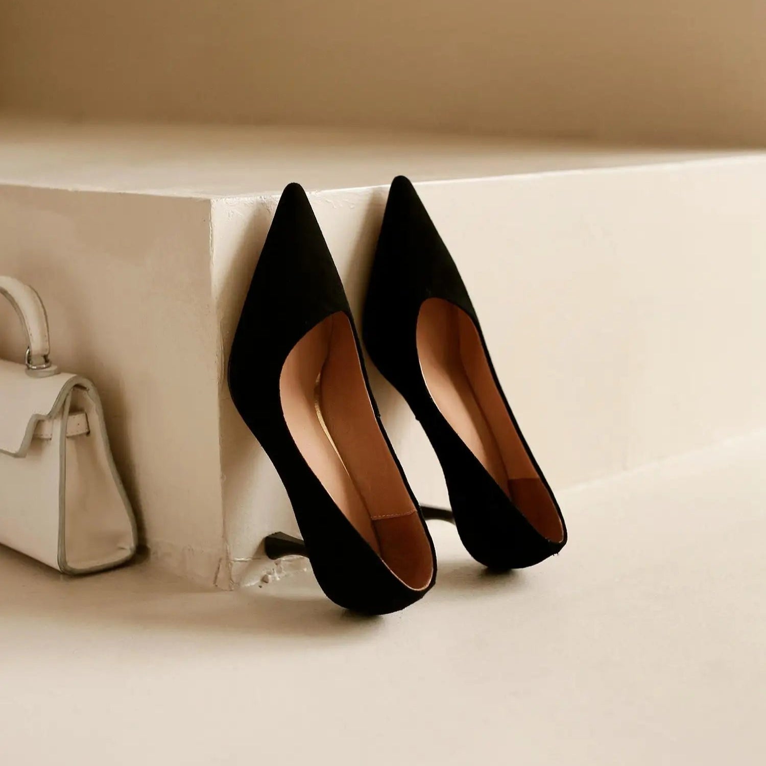 black-suede-kitten-heel-pumps-pair