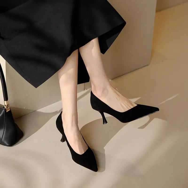black-suede-kitten-heel-pumps-sitting