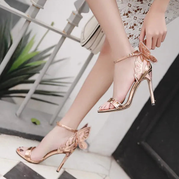 rose-gold-butterfly-heels-pair-woman