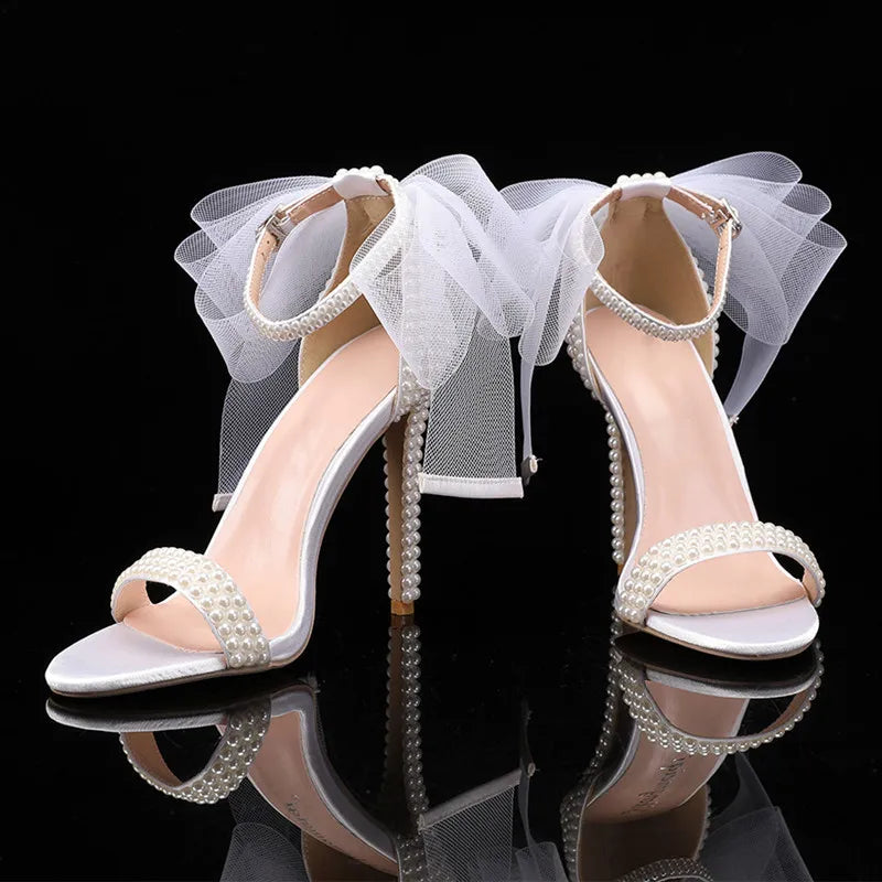 white-heels-with-bow-and-pearls-front