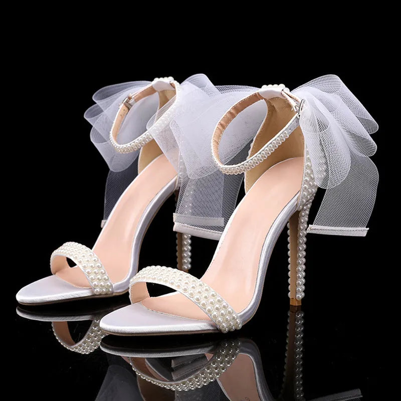 white-heels-with-bow-and-pearls-pair