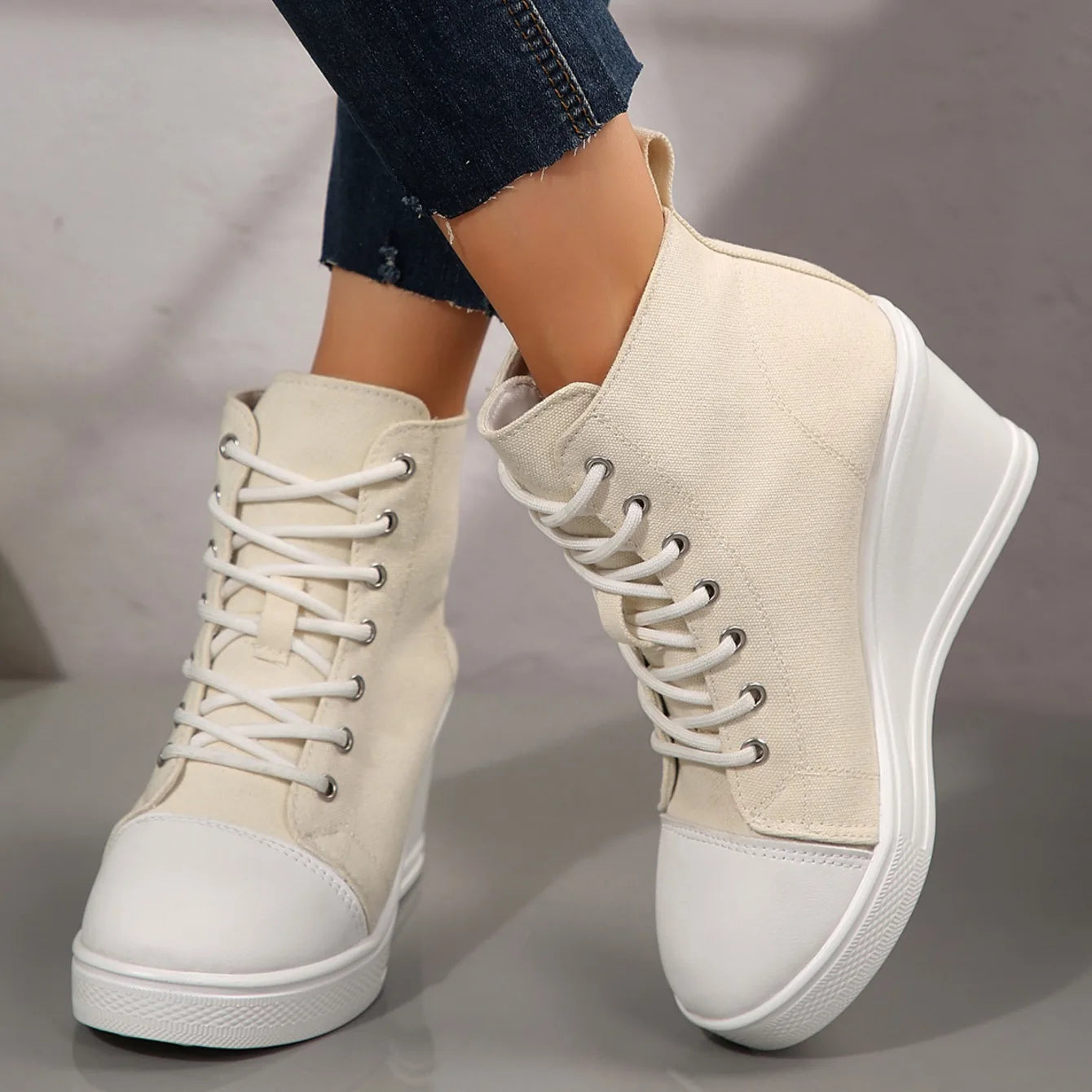 beige-high-top-wedge-sneakers-crossed-legs