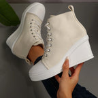 beige-high-top-wedge-sneakers-hand