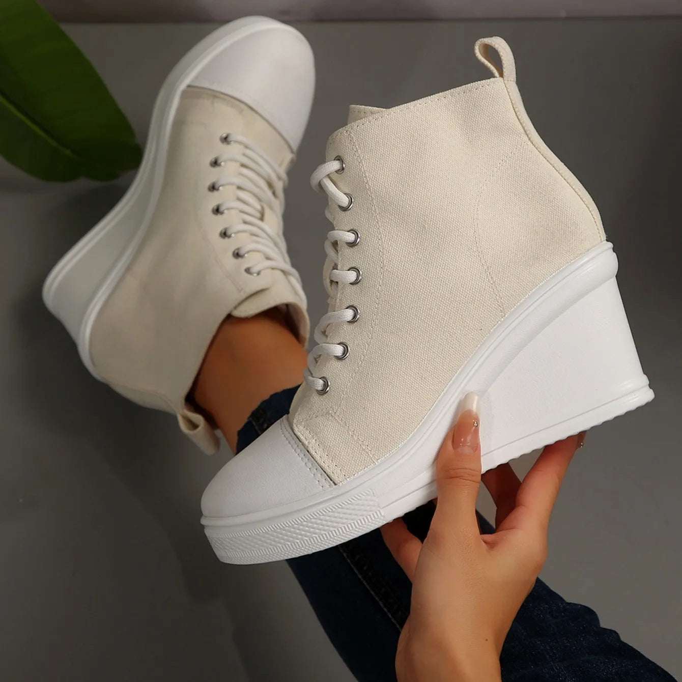 beige-high-top-wedge-sneakers-hand