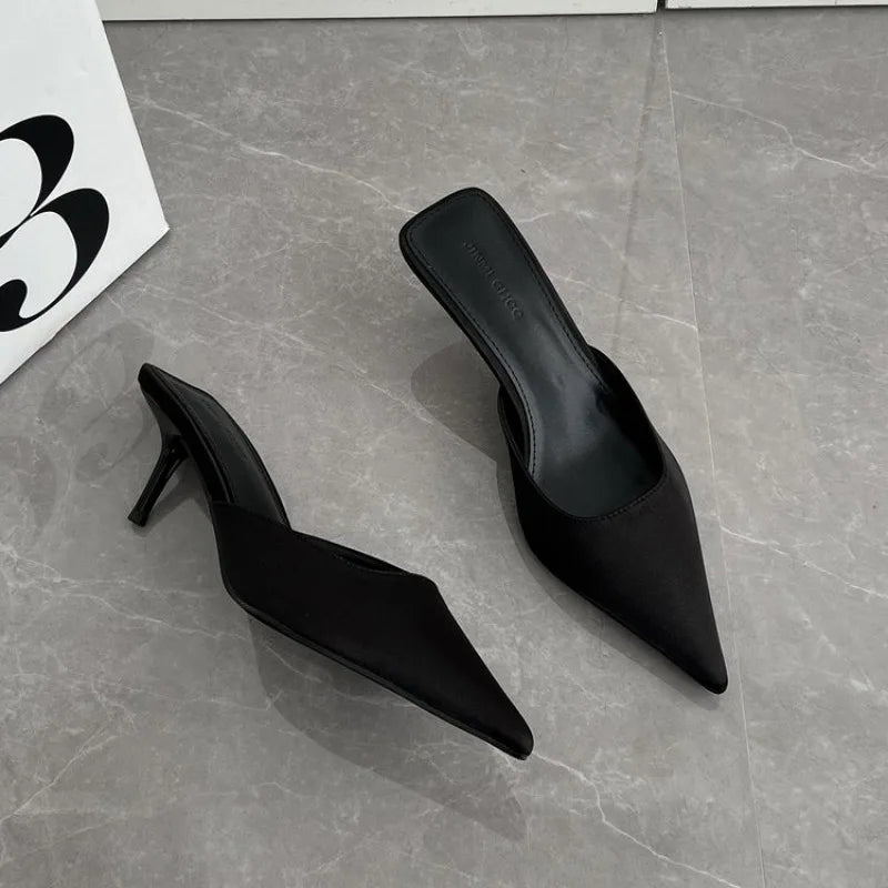 black-closed-toe-mule-heels-pair