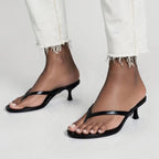 black-flip-flop-kitten-heels-pair