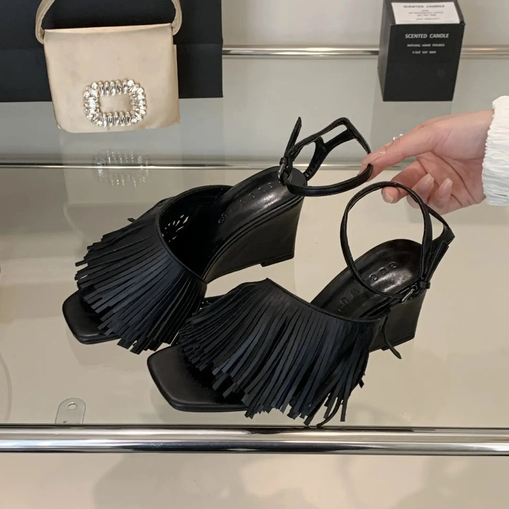 black-fringe-wedge-sandals-pair