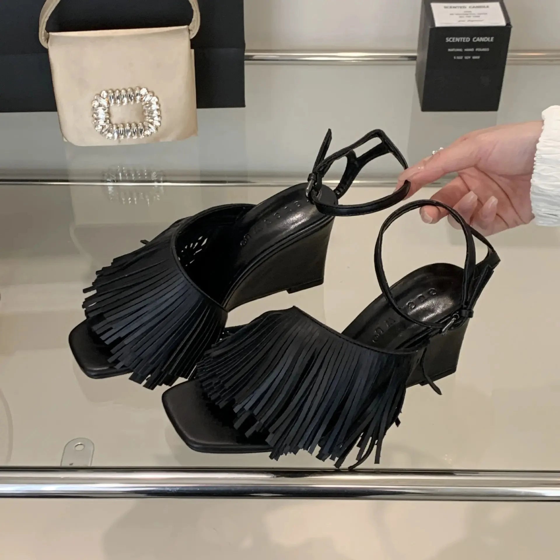black-fringe-wedge-sandals-pair