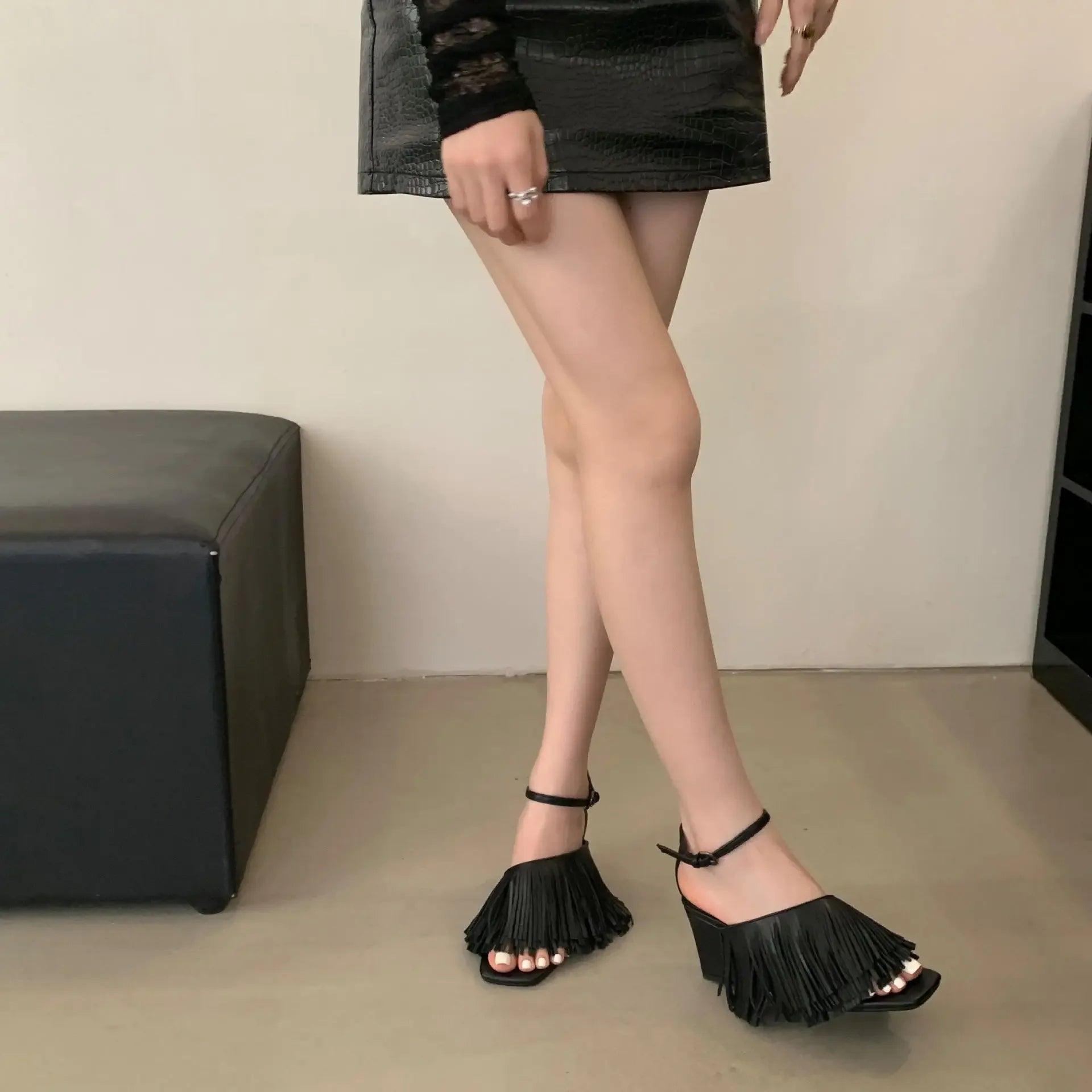 black-fringe-wedge-sandals-standing