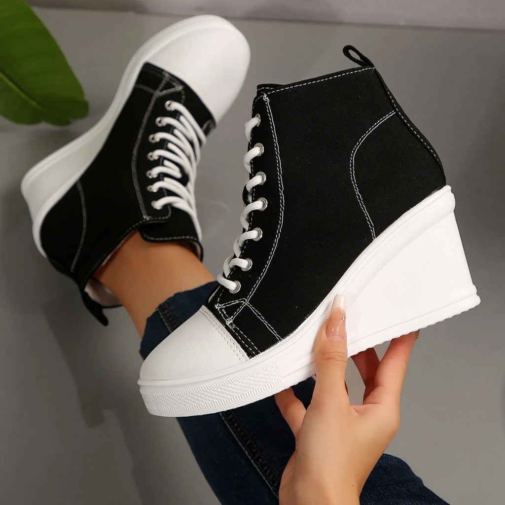 black-high-top-wedge-sneakers-hand