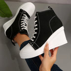 black-high-top-wedge-sneakers-hand