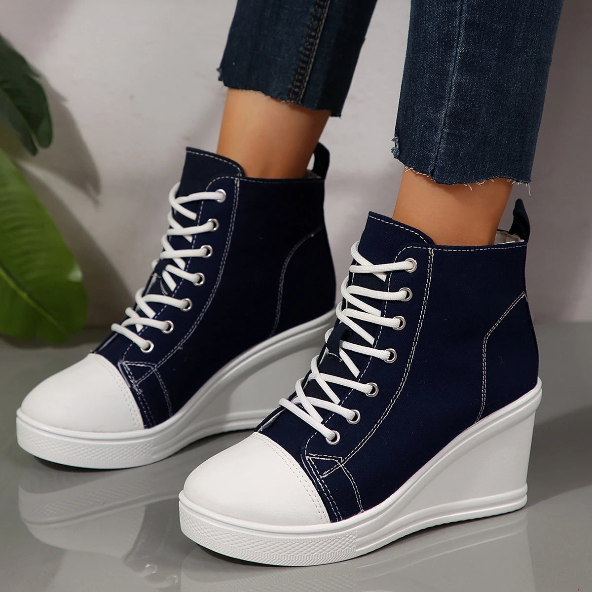 black-high-top-wedge-sneakers-pair