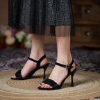 black-ruffle-heeled-sandals-woman-pair