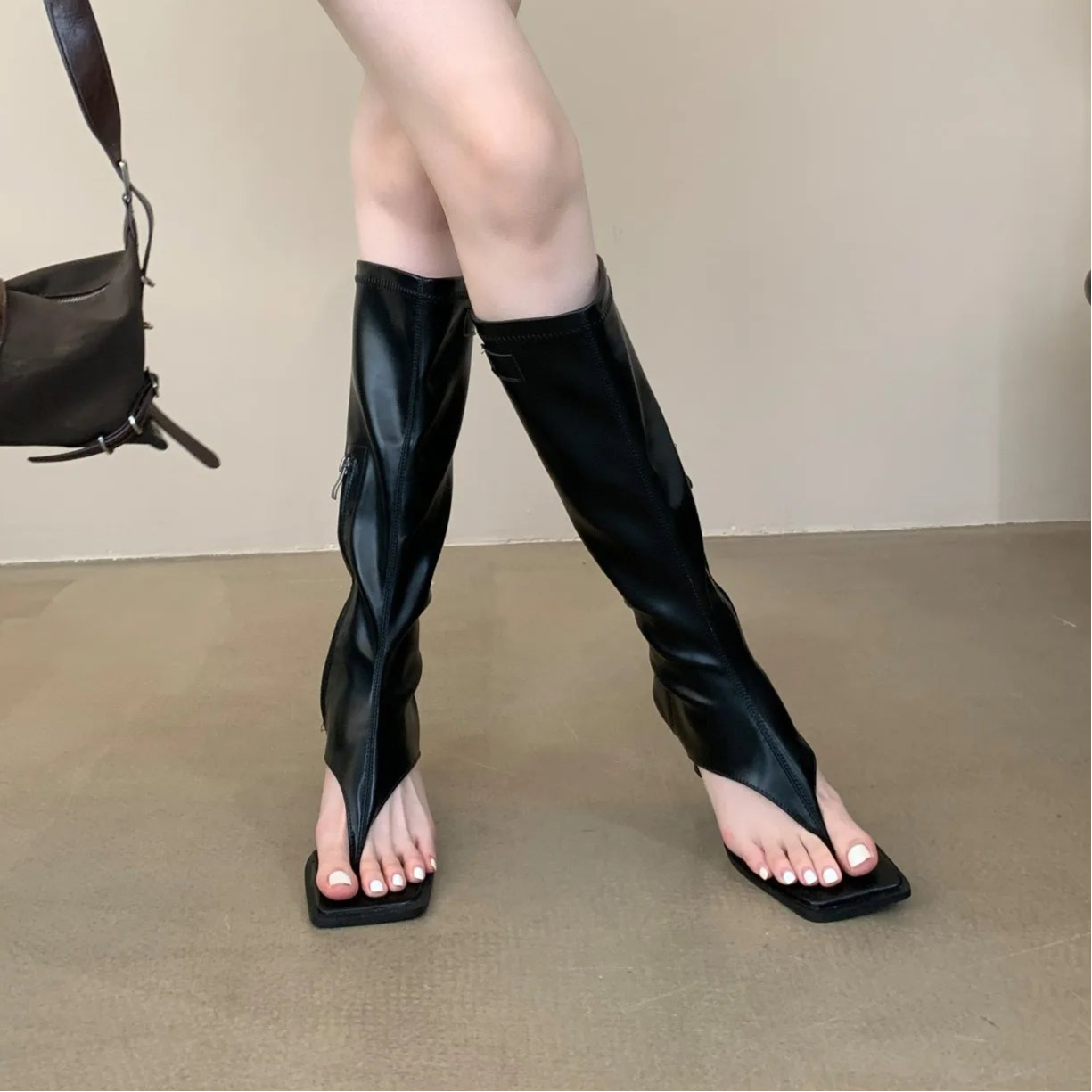 black-thong-heel-boots-pair