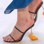 broken-egg-high-heels-black