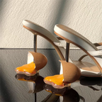 broken-egg-high-heels-white-heel-closeup