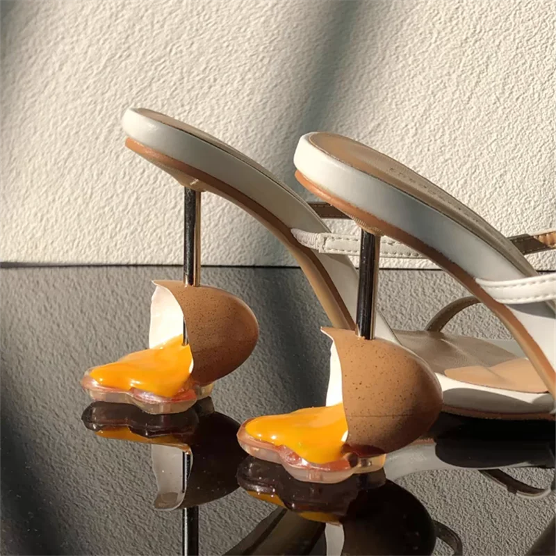 broken-egg-high-heels-white-heel-closeup