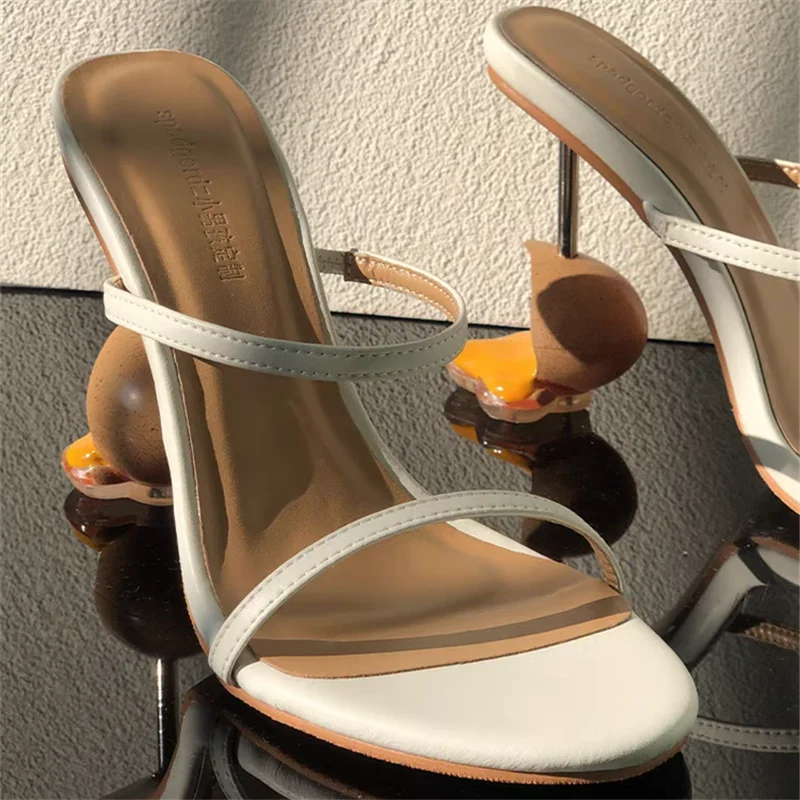 broken-egg-high-heels-white-pair-closeup