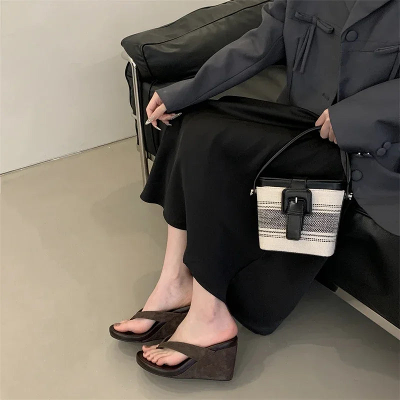 brown-flip-flop-wedges-sitting-woman