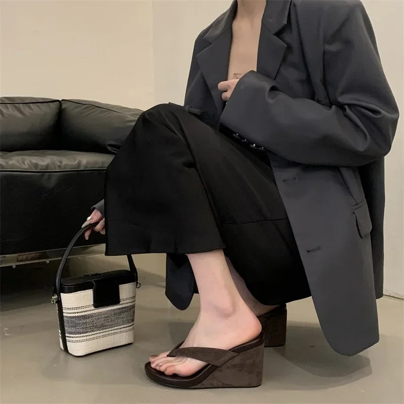 brown-flip-flop-wedges-squatting-woman