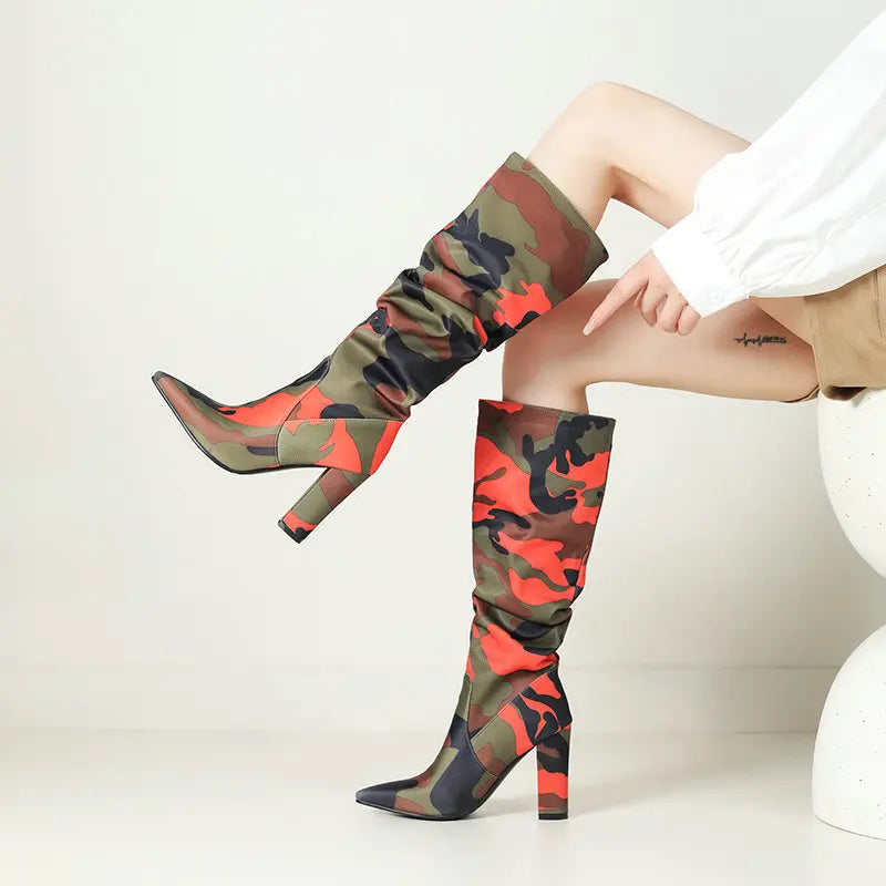 camo-high-heel-boots-orange-details-model-sitting