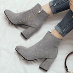 grey-block-heel-booties-pair-woman