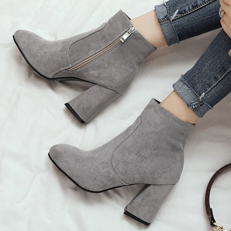 grey-block-heel-booties-pair-woman