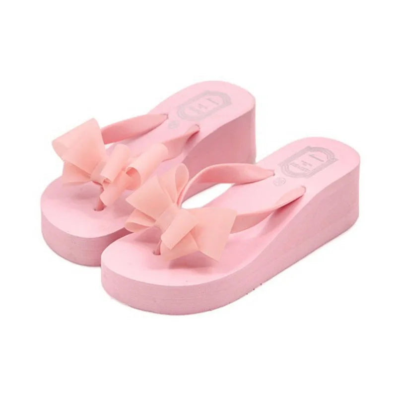 pink-wedge-flip-flops-with-bow-pair