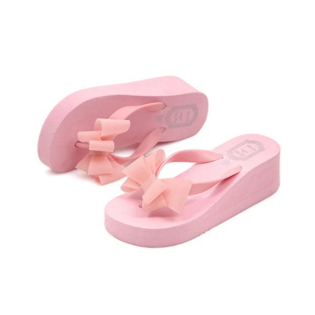 pink-wedge-flip-flops-with-bow