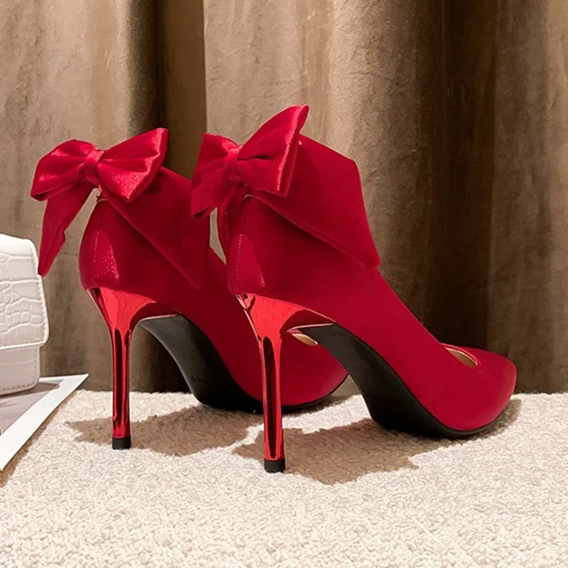 red-heels-with-bow-on-back-back