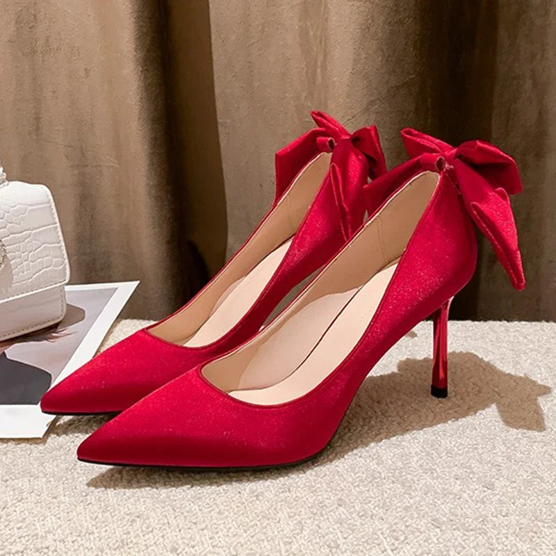red-heels-with-bow-on-back-pair