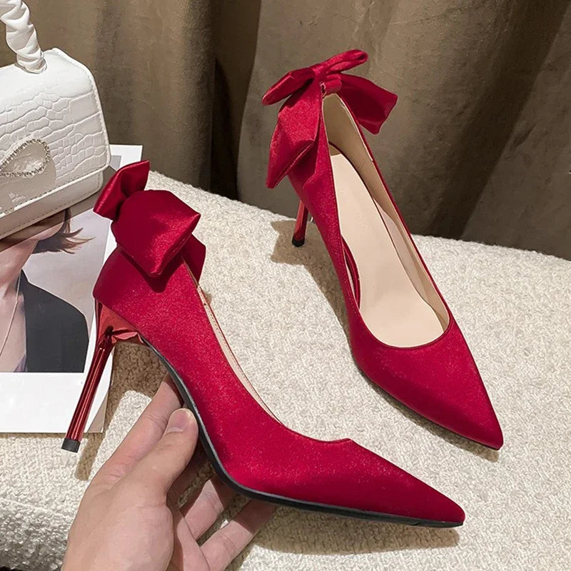 red-heels-with-bow-on-back-side