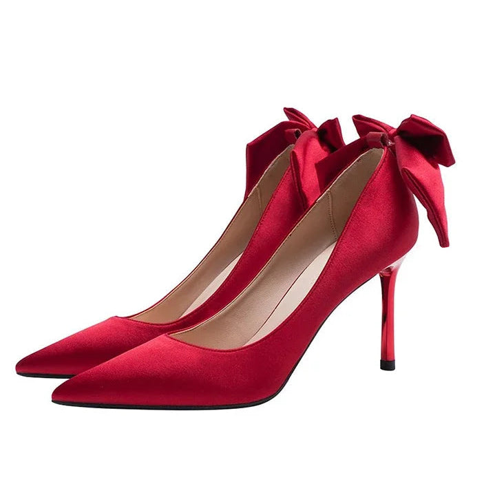 red-heels-with-bow-on-back