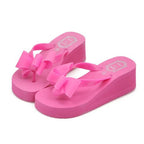 rose-wedge-flip-flops-with-bow-pair