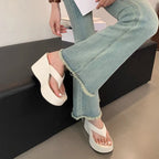 white-flip-flops-with-wedge-heel-wearing