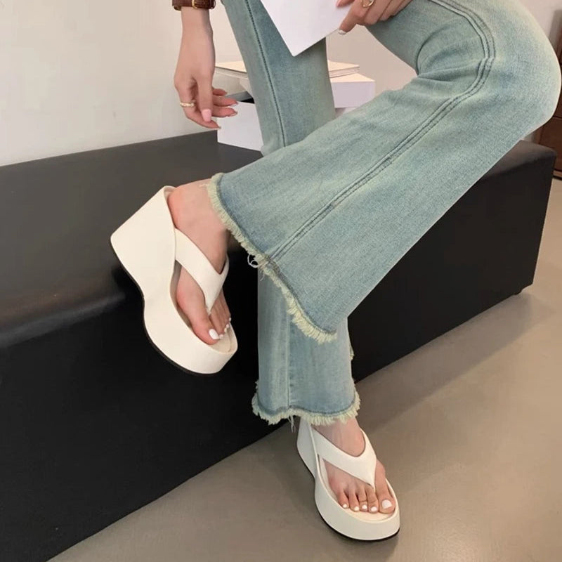 white-flip-flops-with-wedge-heel-wearing