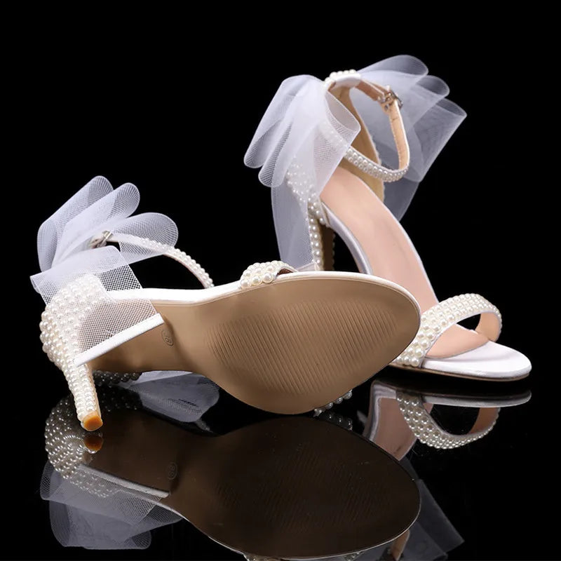 white-heels-with-bow-and-pearls-bottom