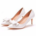 white-heels-with-bow-on-front-3-inch-pair