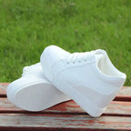 white-hidden-wedge-sneakers-pair-photo