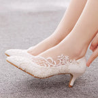 white-lace-wedding-shoes-low-heel-pair-woman