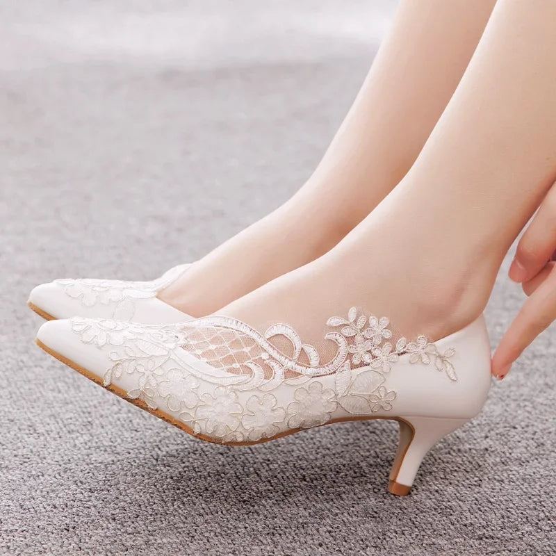 white-lace-wedding-shoes-low-heel-pair-woman
