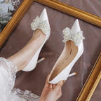 white-wedding-heels-with-bow-top