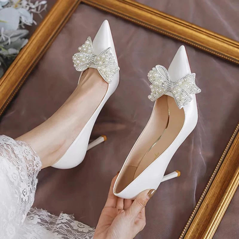 white-wedding-heels-with-bow-top