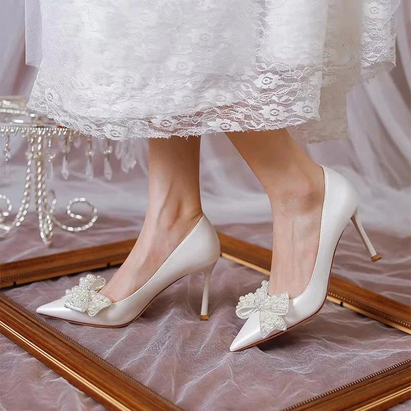 white-wedding-heels-with-bow-walk