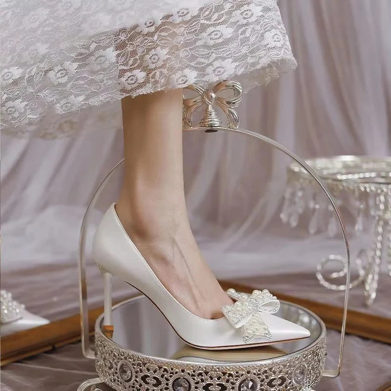 white-wedding-heels-with-bow-woman