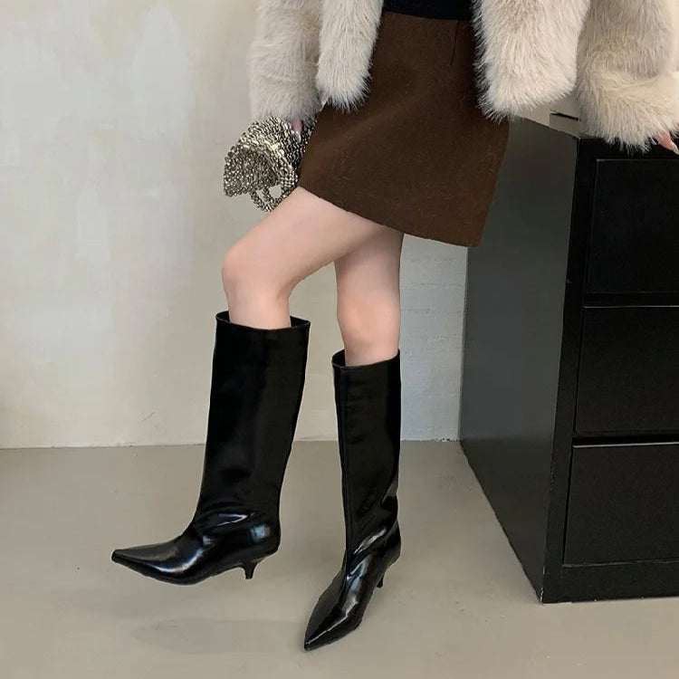woman-in-brown-skirt-wearing-black-kitten-heel-knee-high-boots