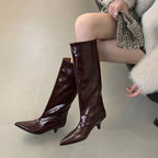 woman-wearing-brown-kitten-heeled-knee-high-boots