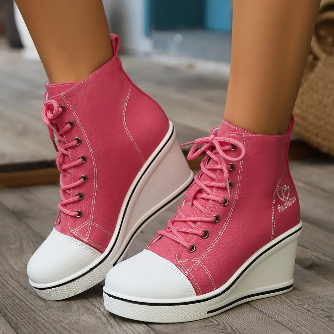 woman-wearing-high-top-pink-wedge-sneakers