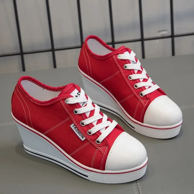 women-red-wedge-sneakers-pair