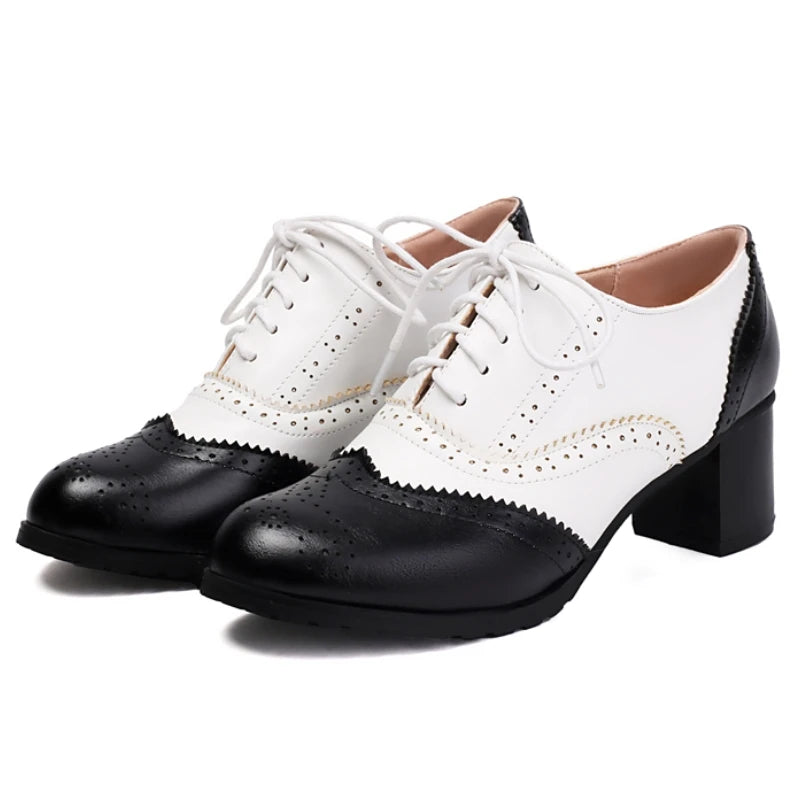 women's-black-and-white-heeled-oxfords-pair